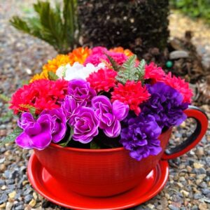 Giant tea cup filled with vibrant flowers